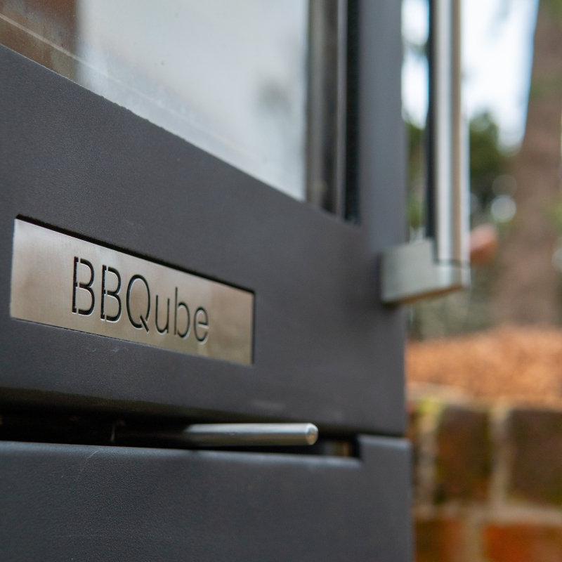 BBQUBE Wood Burning Heater and Grill with Log Store` in Black